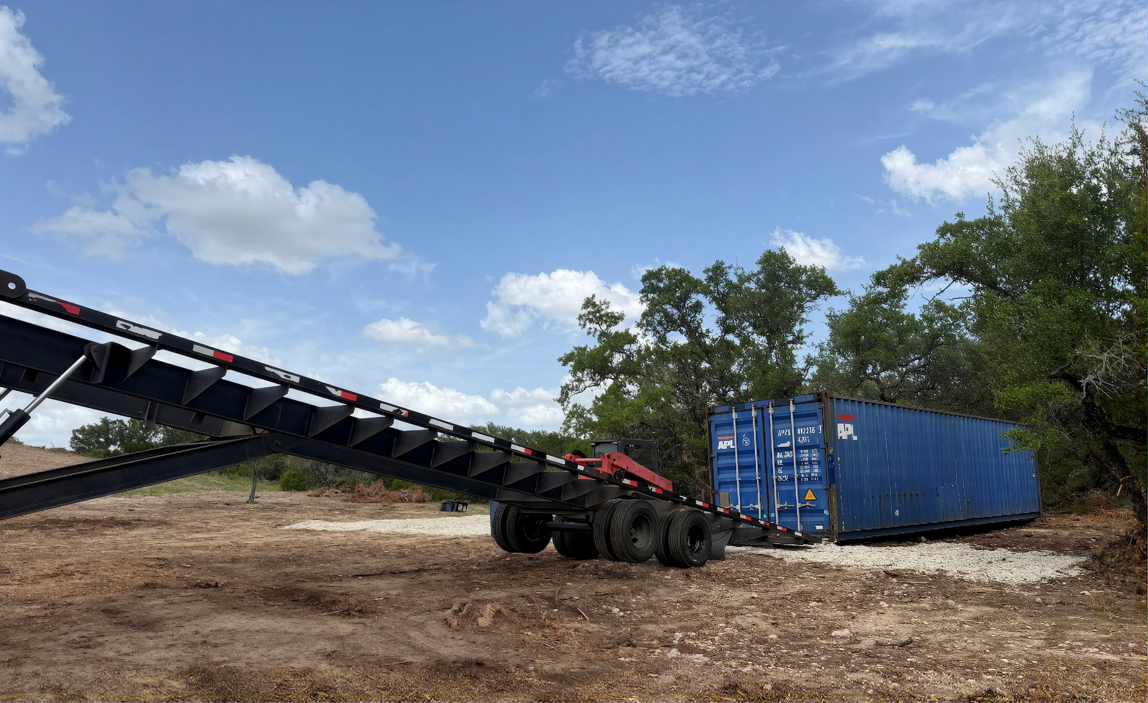 40-foot shipping container being transported by 4J Services