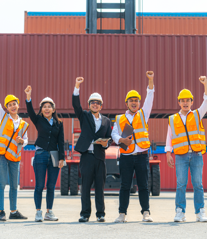 team of happy people in storage container yard